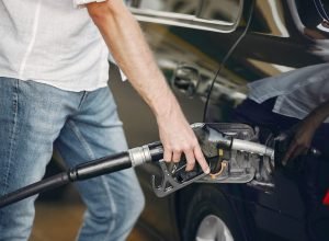 handsome-man-pours-gasoline-into-tank-car-scaled-1.jpg